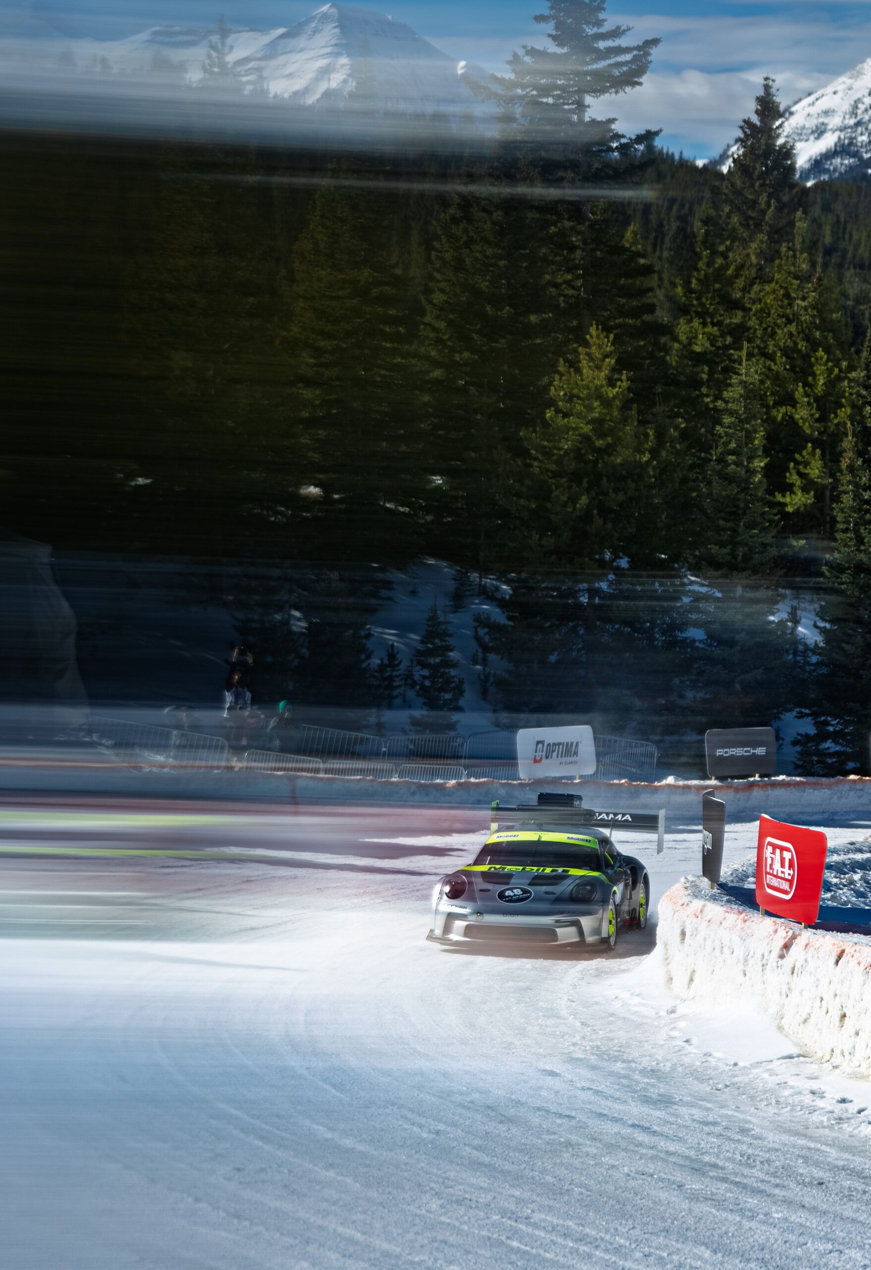 Porsche racing car driving through the snow at Fat Ice event