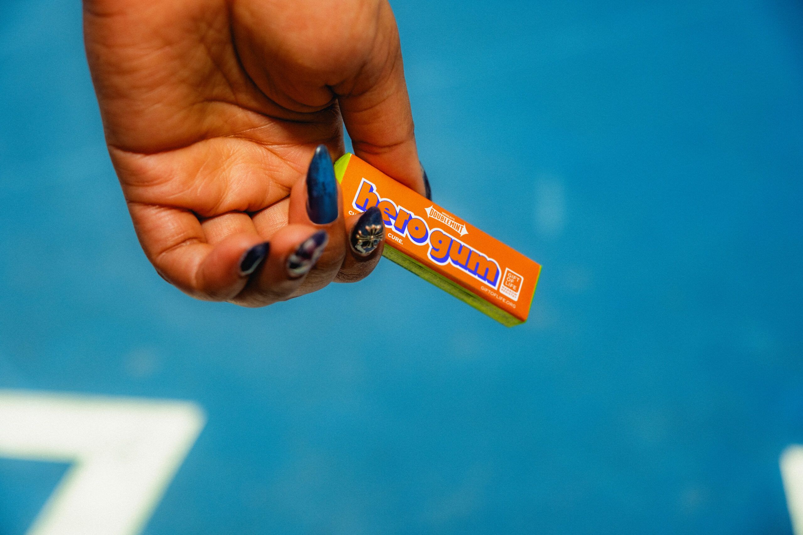 Person holding pack of hero gum